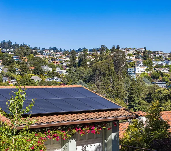 Individual rooftop solar panels on a Kerala home